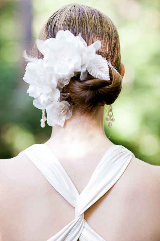 Woman in wedding dress with flower hairpiece