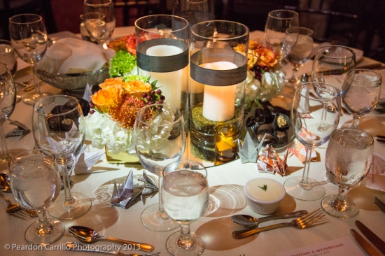 Elegant wedding centerpiece with candles and flowers