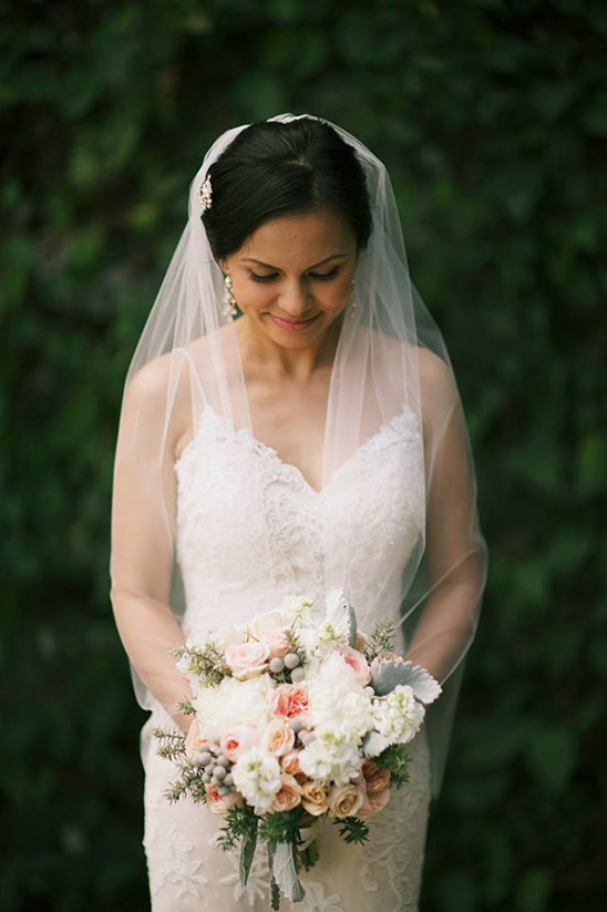 Beautiful bride holding her wedding bouquet