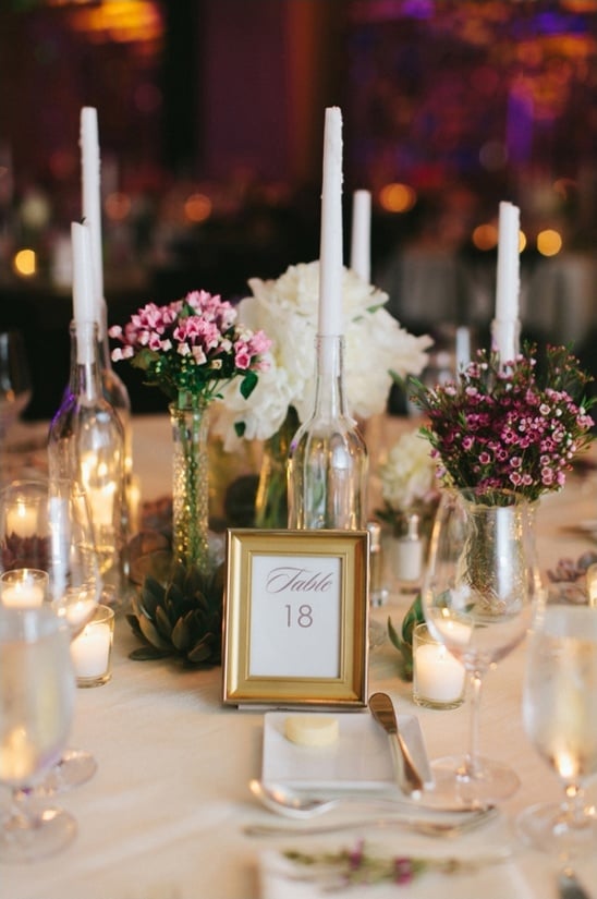 elegant table number with wine bottle candle holders