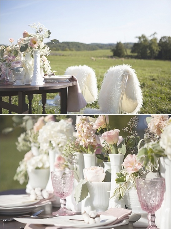 Elegant outdoor wedding table setting with flowers and decor
