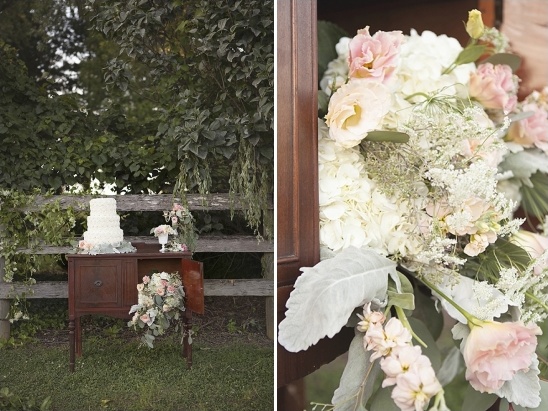 Rustic wedding decor with cake and flowers on a vintage table