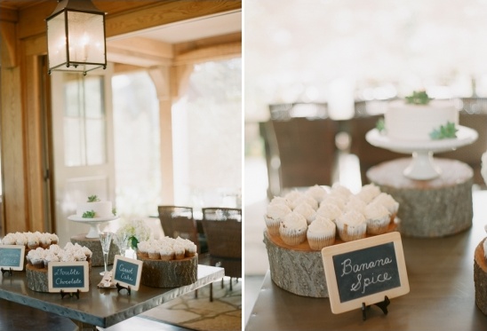 Elegant cupcake and cake display at outdoor wedding