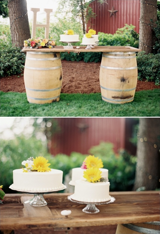 cake table created from an old door and wine barrels