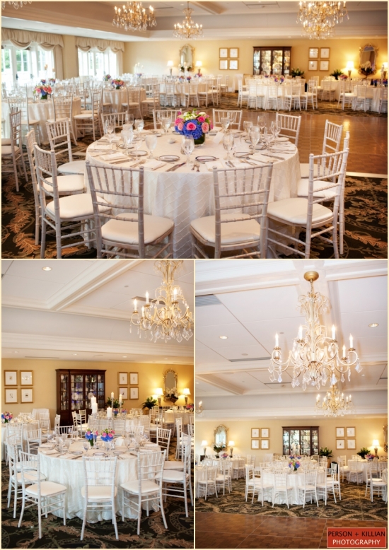 Elegant wedding reception venue with white chairs and floral centerpieces