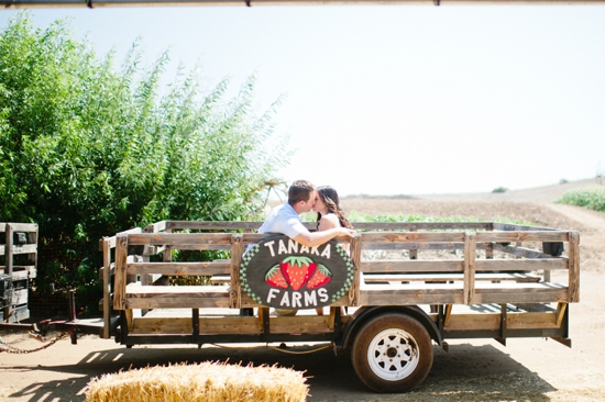Couple kissing on Tanaka Farms wagon