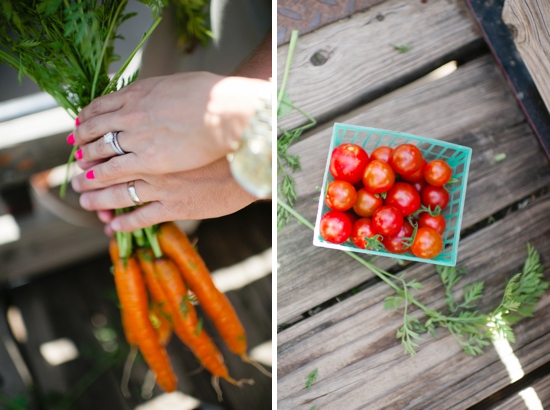Couple's hands holding carrots and a basket of tomatoes