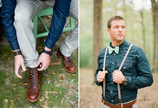 Man in denim shirt and suspenders, tying brown leather boot laces