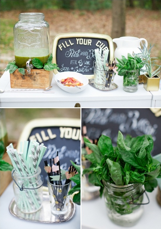 Wedding reception drinks setup with chalkboard and basil