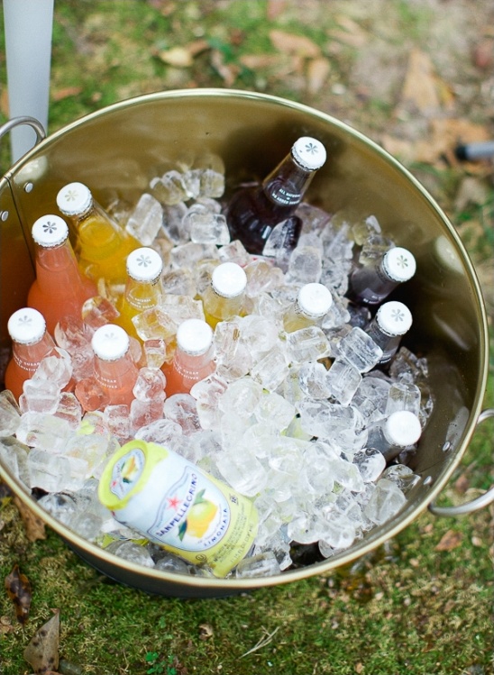 Chilled drinks in a gold bucket filled with ice for a refreshing treat