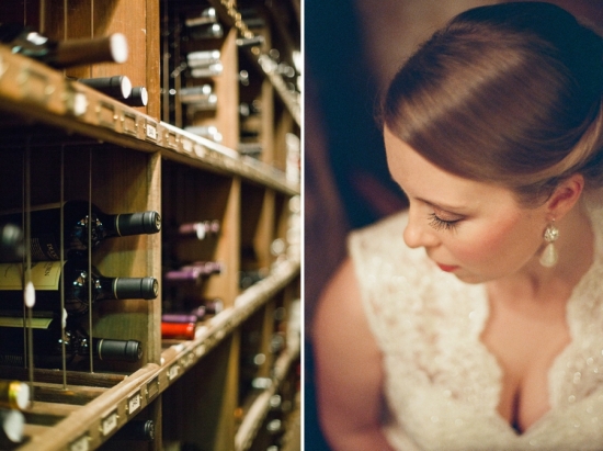 Bride beside a wooden wine rack at a wedding venue
