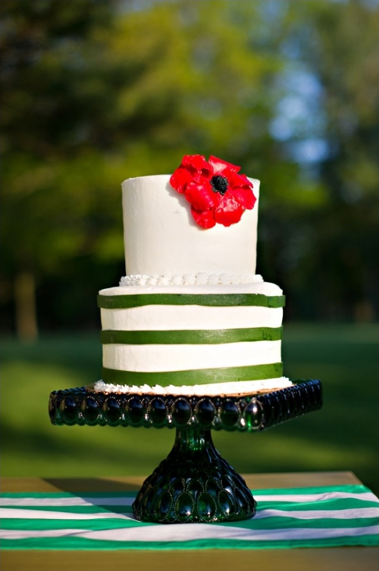 green and white wedding cake with red poppy by second floor bakery
