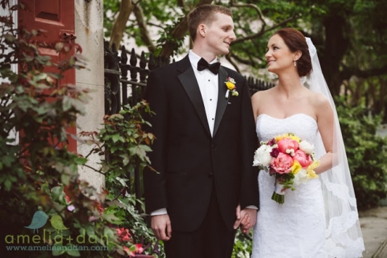 Newlyweds gazing at each other on their wedding day, holding hands