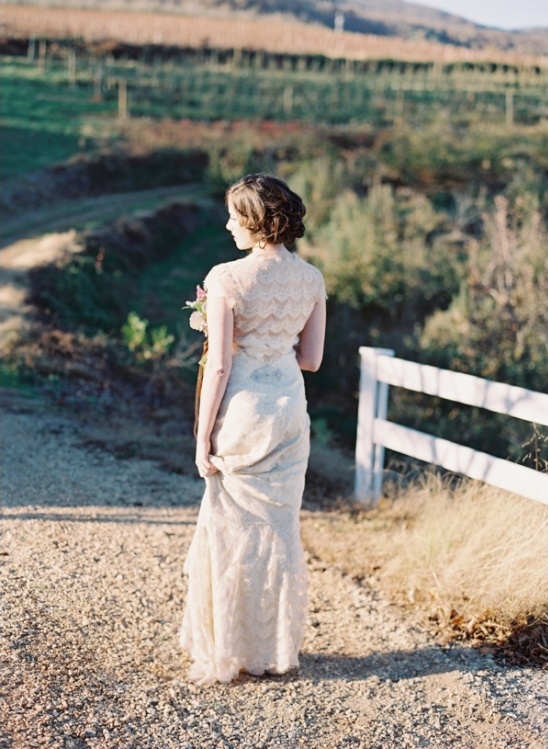 tiered lace wedding dress by Claire Pettibone