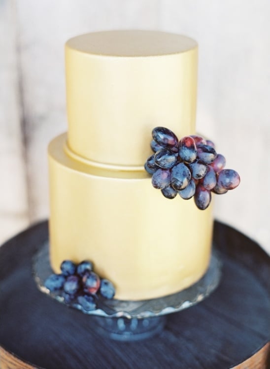 elegant wedding cake with grape garnishes