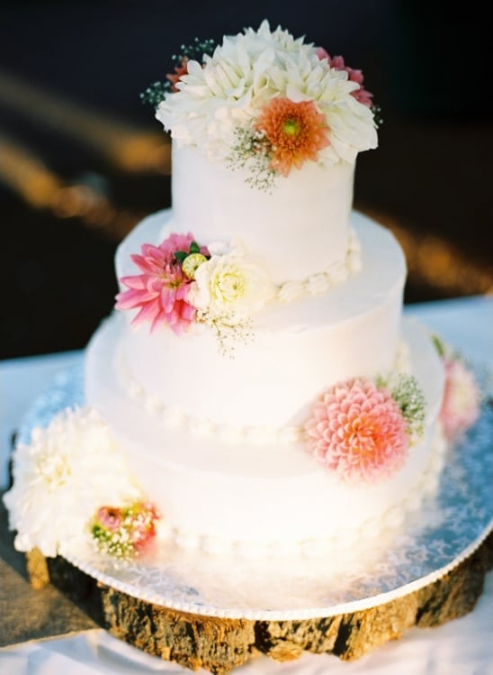 white wedding cake topped with florals