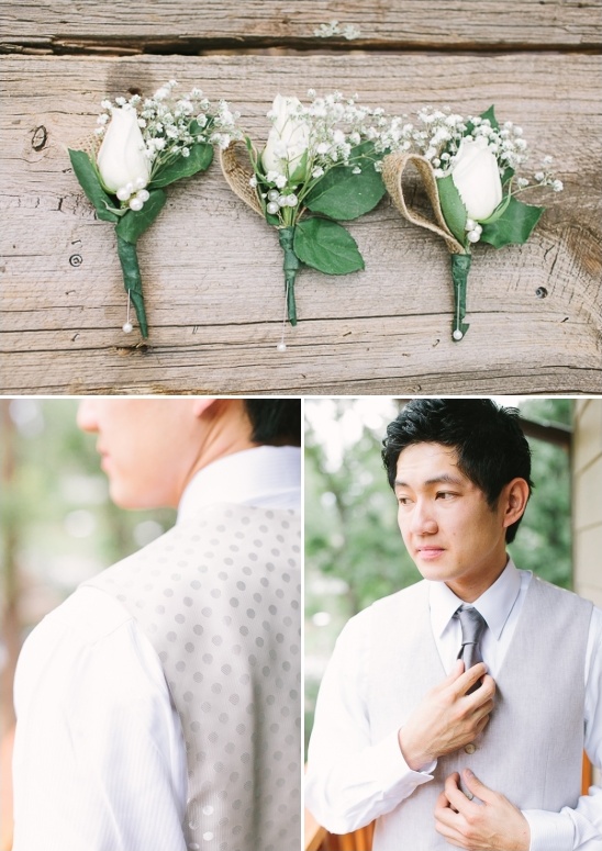 white rose boutonnieres and cream colored groom attire