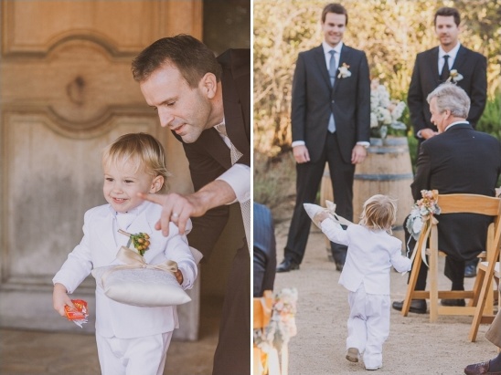 Adorable ring bearer walking down the aisle at a wedding