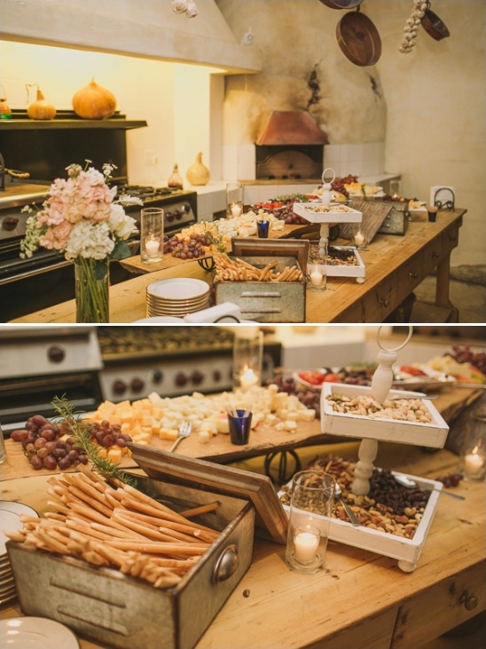 Rustic cheese and snack buffet on a wooden table, perfect for events