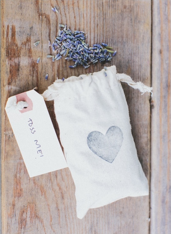 Lavender sachet with a heart on rustic wooden background