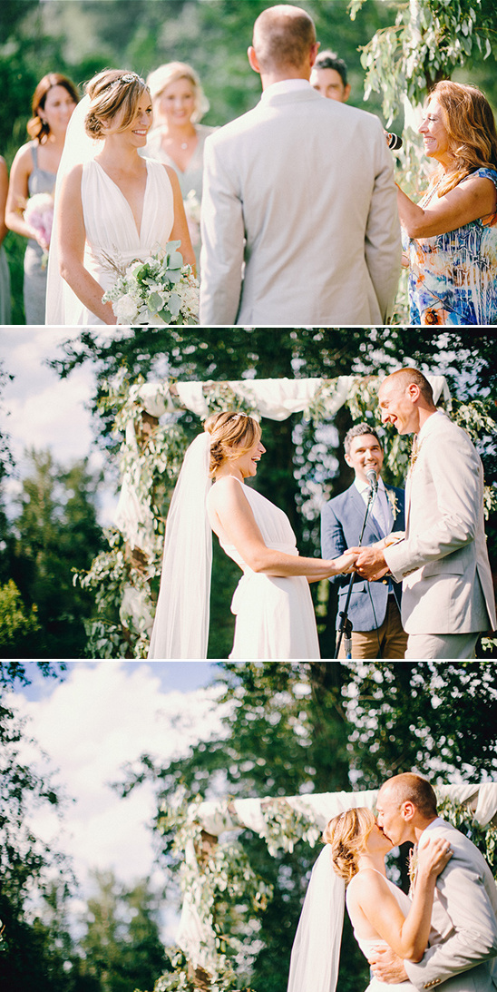 Bride and groom exchanging vows during an outdoor wedding ceremony