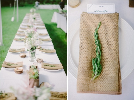 Elegant wedding table setting with rosemary detail and place cards