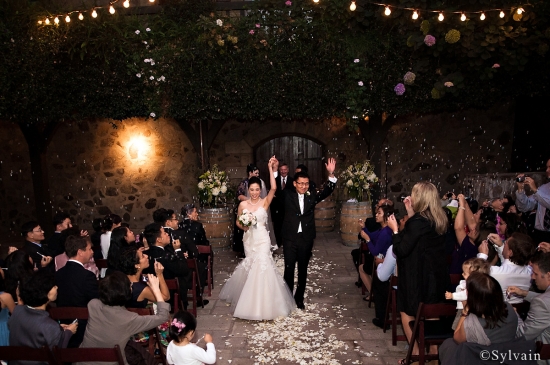 Happy couple walking out of wedding ceremony