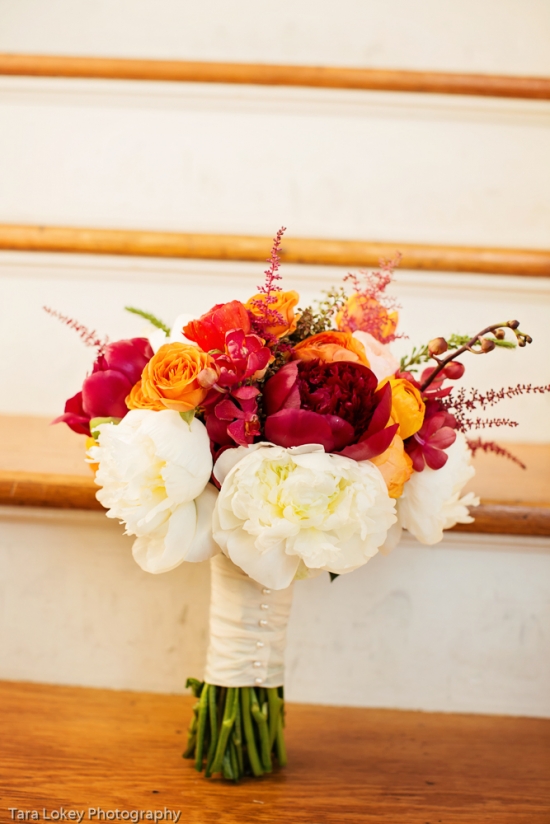 Vibrant floral bridal bouquet with peonies and roses