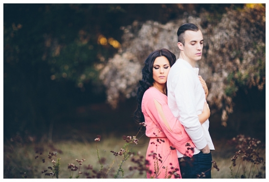 Romantic couple embracing in a field