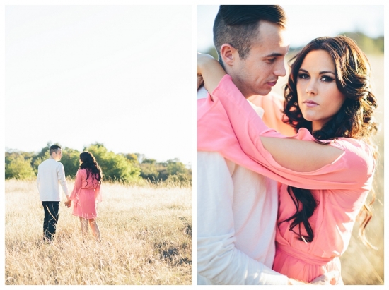 Romantic couple embracing in a field at sunset