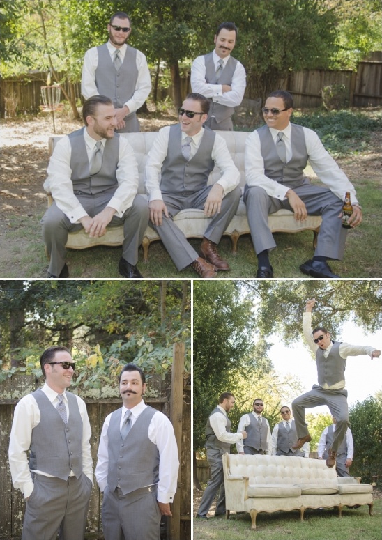 Groomsmen in vests pose at outdoor wedding party