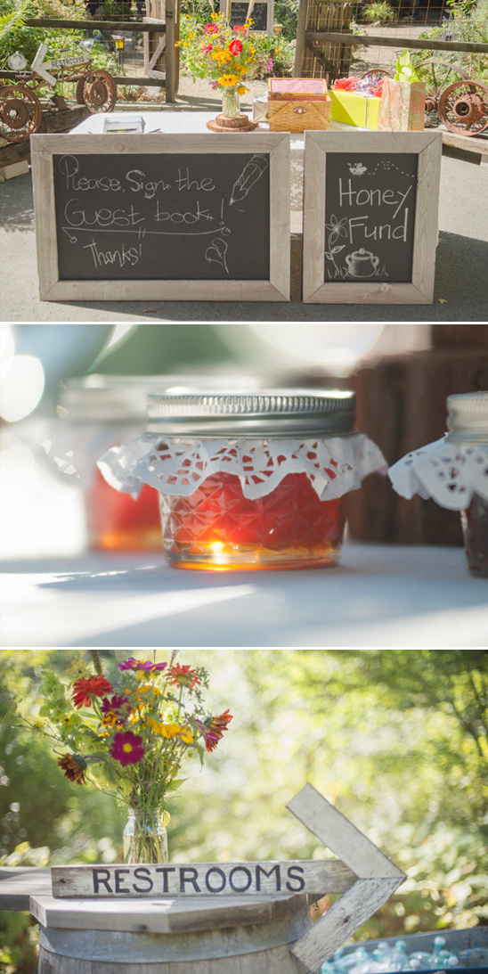 Rustic wedding decor including guest book and restroom sign