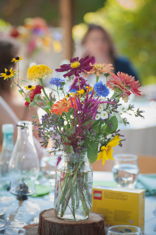 Wildflower bouquet in mason jar centerpiece outdoors