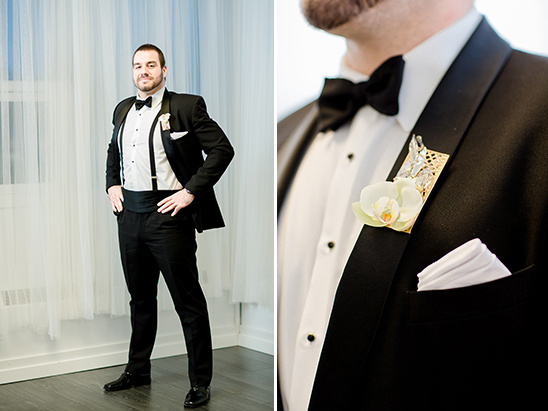 Groom in black tuxedo with bow tie and floral boutonniere, ready for wedding