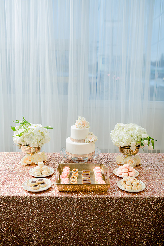 Elegant wedding table with cake, flowers, and sweets