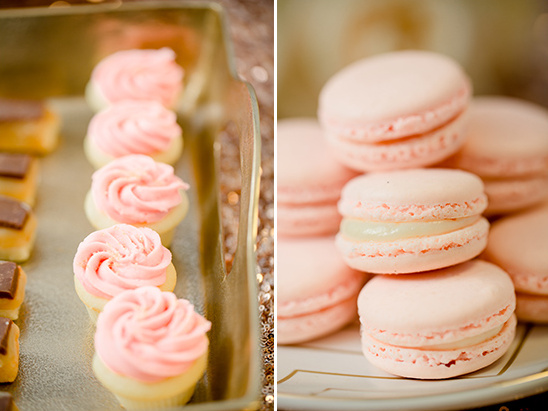 Pink cupcakes and macarons on a tray, perfect for a celebration