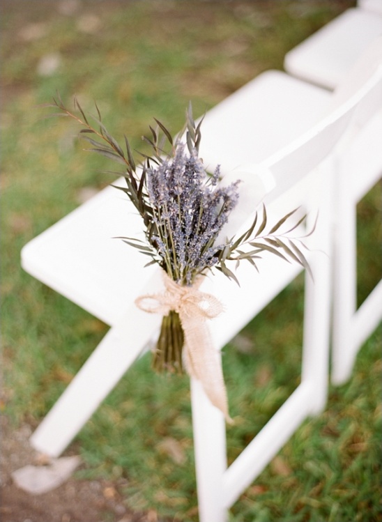 Lavender bouquet tied with ribbon on chair