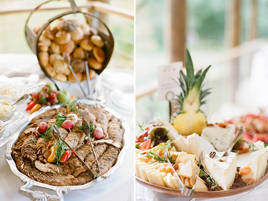 Elegant buffet with breads cheeses and roasted meat