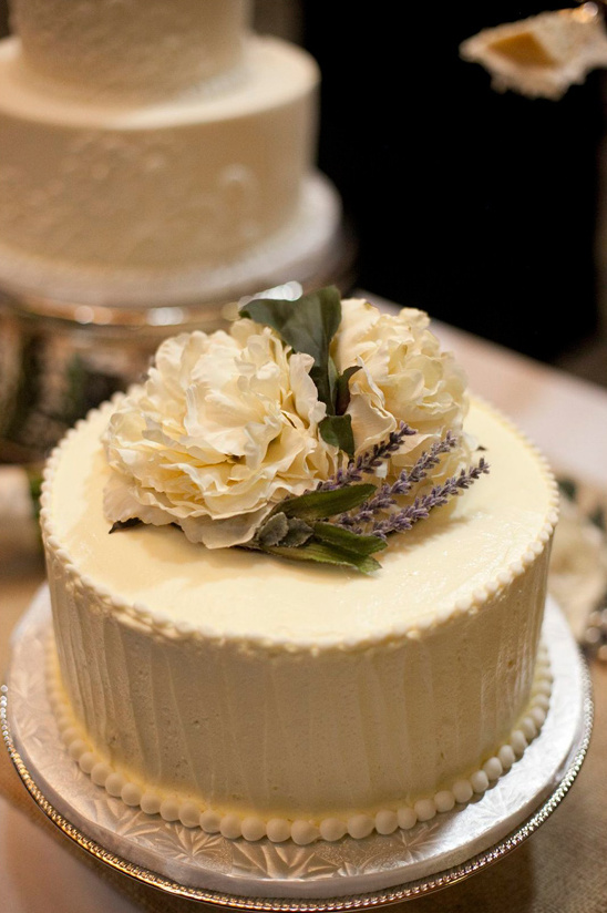 Elegant tiered cake decorated with flowers and lavender