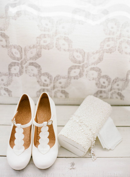 White bridal shoes and beaded clutch