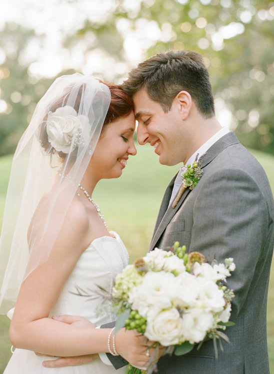 Happy bride and groom share a tender moment