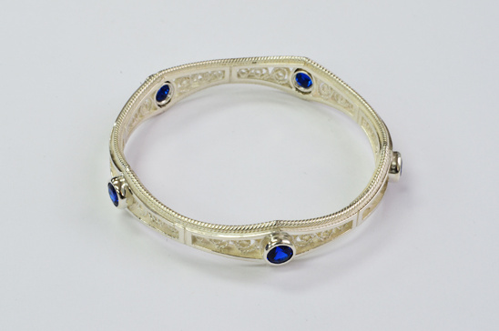 Silver bangle with blue stones