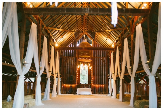Rustic wedding venue inside of an elegant decorated barn