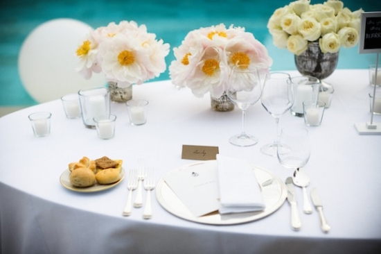 Elegant wedding table setting with flowers and fine dining details