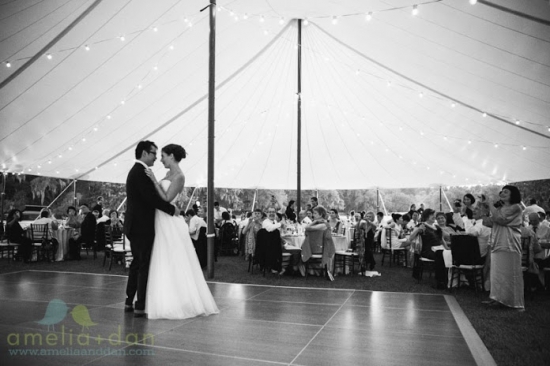 Happy couple dancing under a tent