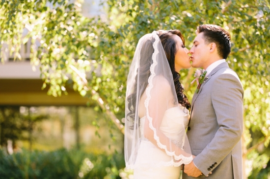 Bride and groom sharing a kiss on their wedding day