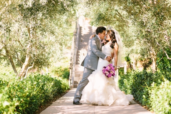 Bride and groom share a kiss on a wedding day with romantic vibe