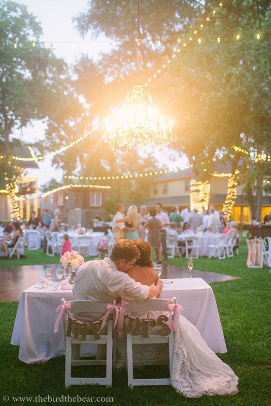 Romantic wedding reception with the happy couple embracing