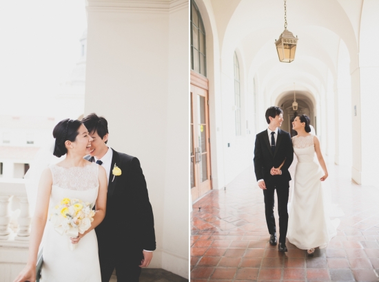 Happy couple on their wedding day, walking together in hallway
