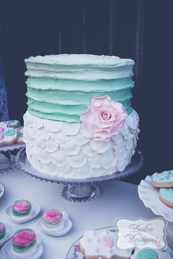 Elegant wedding cake with a big pink rose decoration